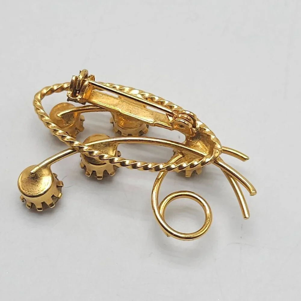 Vintage Gold Tone Floral Brooch With Amber Colored Rhinestones